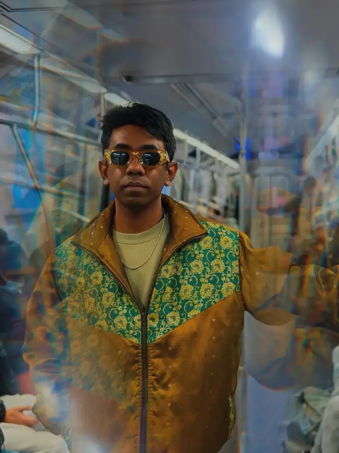 Portrait of Elius in a green and gold jacket